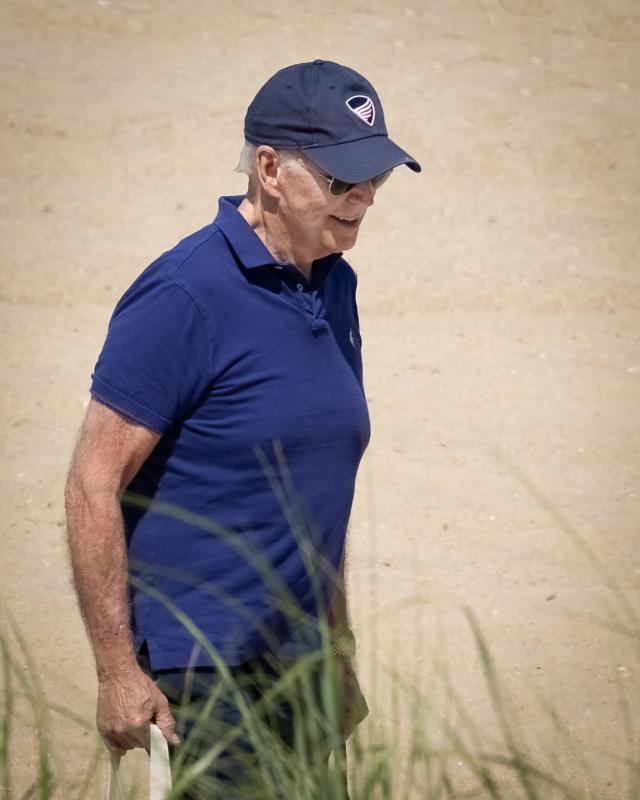 Joe Biden may be the president, but he still has to carry Jill’s bag to the beach. SCOTT BECQUE PHOTO